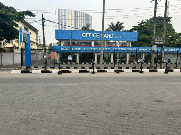 The OfficeLand furniture showroom on Idowu Martins Street, its frontage listing desks, chairs, conference tables and filing cabinets