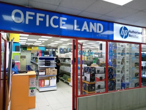The OfficeLand counter inside Century 21 Mall, with HP authorised reseller signage and shelves of stationery and IT supplies